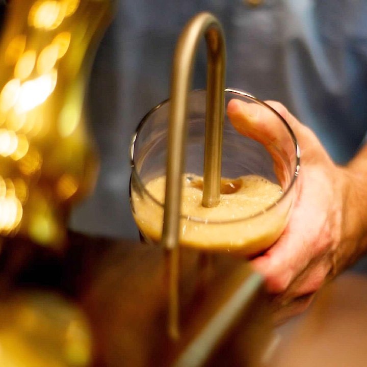 Beer pouring into a glass.