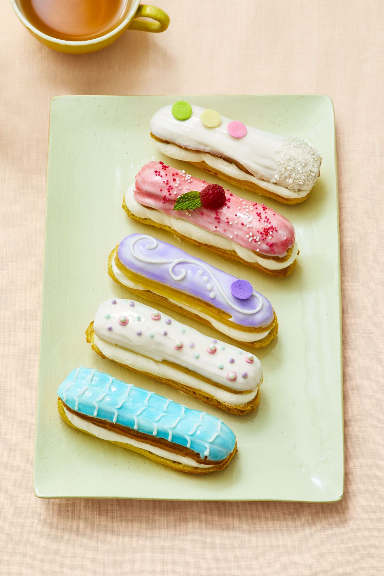 Small French pastries with various shades of pastel icing.