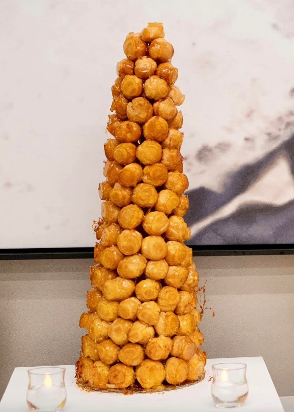 A croque en bouche, a French cake made up of small pastry balls assembled in a cone.