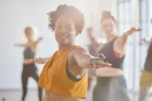 People stretching their arms out during a yoga class.