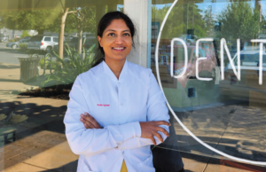 Dr. Mudita Agrawal in front of the Future Dental office.