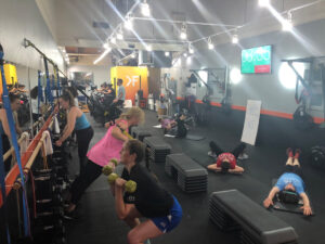 Various people exercising in the Studio K-Fit gym.