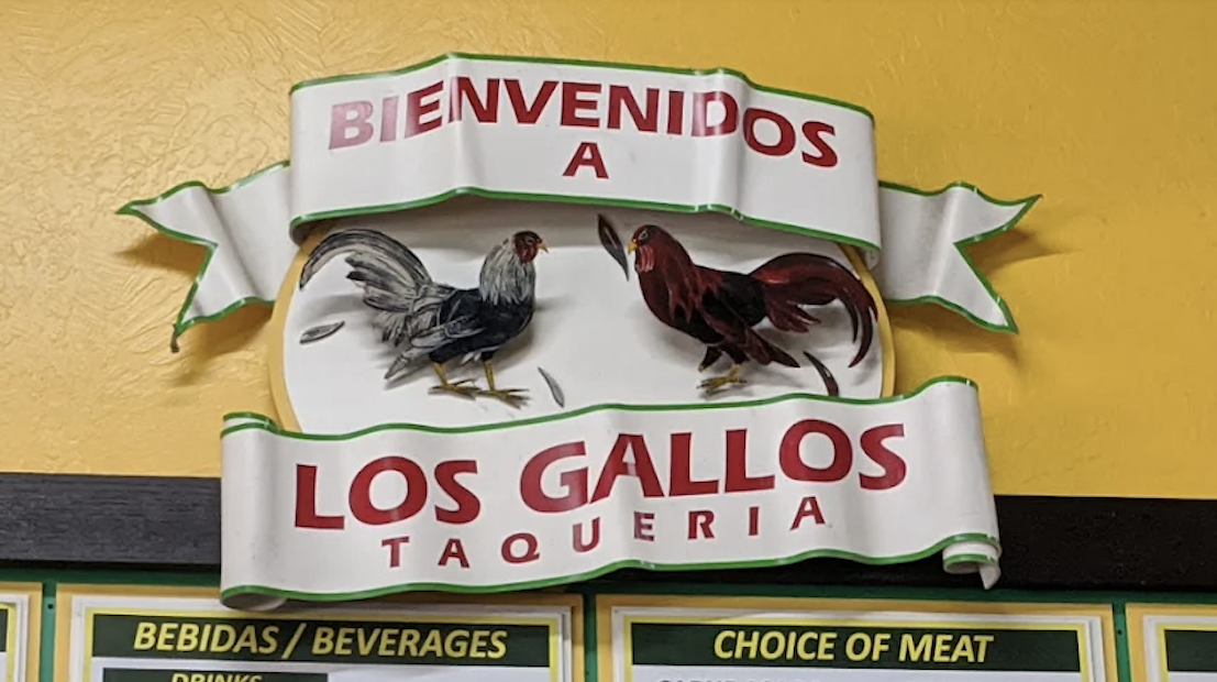 The Los Gallos logo, mounted on the restaurant wall.