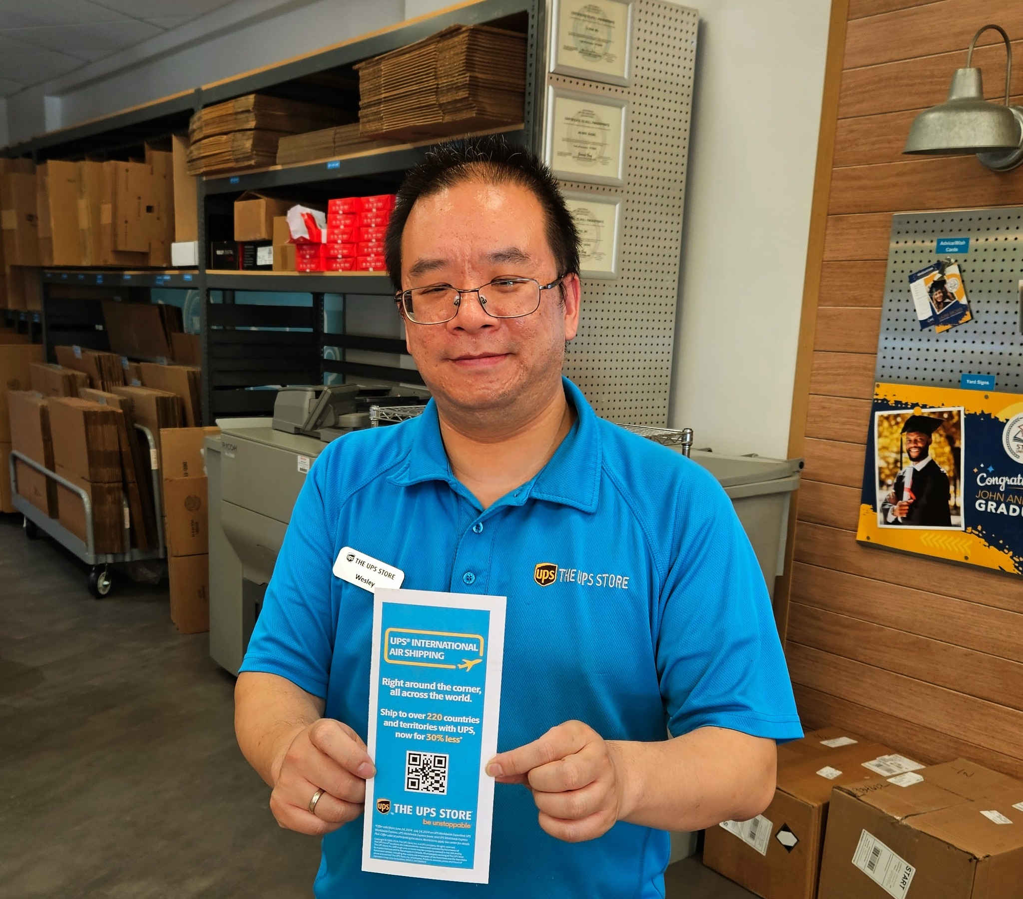 Wesley inside the UPS store packing area.